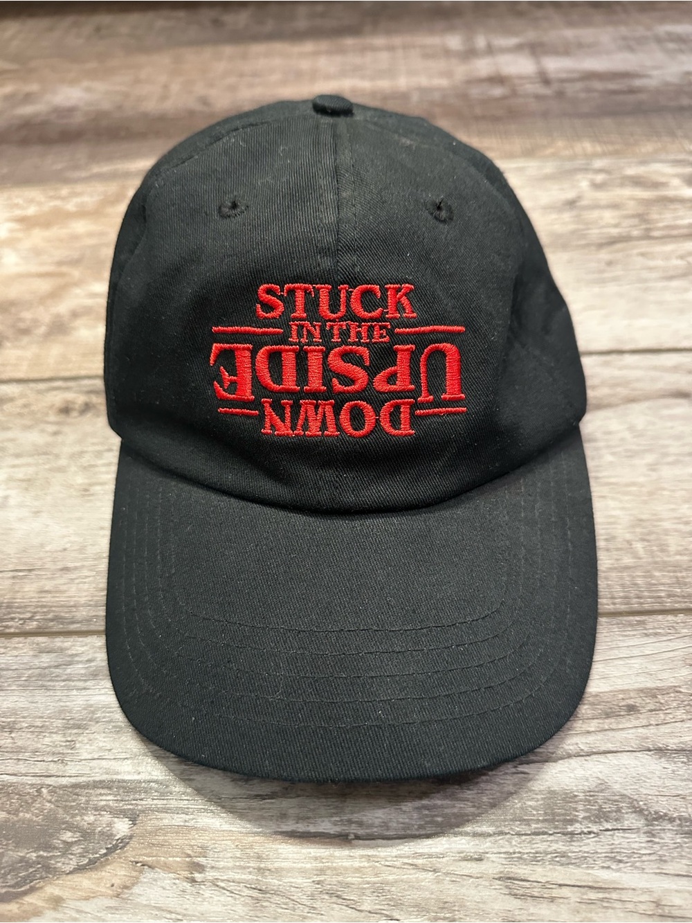 Black Baseball Cap with Red Upside-Down Embroidered Text